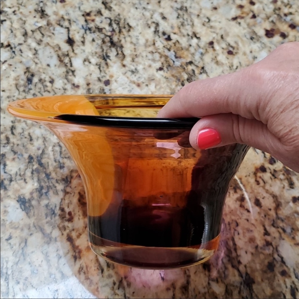 Blown glass bowl in Orange, Yellow and purple.